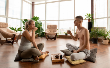 Couple drinking tea during yoga
